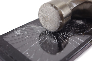 broken phone with hammer isolated on white background, crash phone, fractured