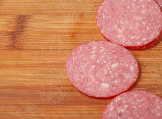Sausage cut into slices on a cutting Board