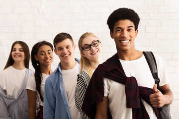 Education concept. Happy teens smiling to camera