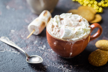 hot cocoa with marshmallows, cream and cookies on holiday christmas background