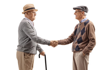 Elderly men shaking hands