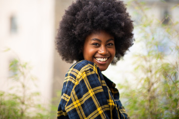 Close up horizontal smiling young black woman with afro hair