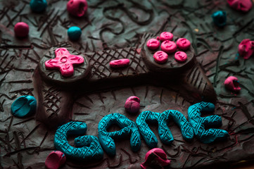 colorful illustration plasticine texture smeared on the board for modeling game joystick and the inscription game