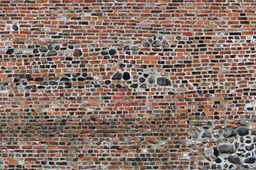 Old Red Brick Wall with Lots of Texture and Color.