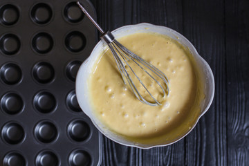 cupcakes dough, ingredients (fresh baked goods, eggs, flour, sugar, and more) menu concept. food background. copy space. Top view