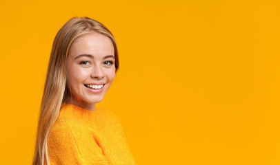 Portrait of beautiful young girl smiling to camera