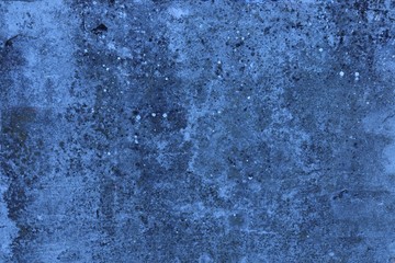 Fototapeta premium Concrete surface of gray-blue heterogeneous color with blue spots.