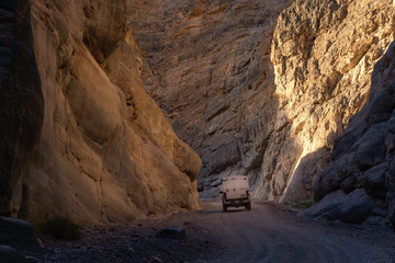 Small camper in Titus Canyon at sunset at Death Valley National Park, CA, USA