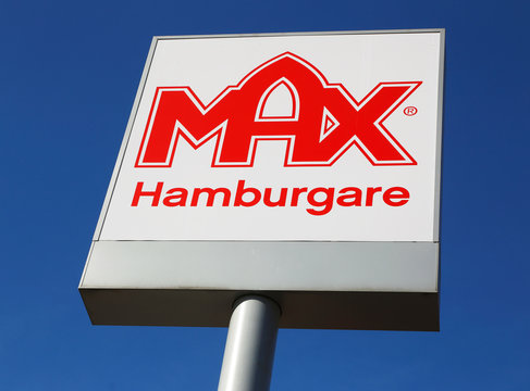 Ornskoldsvik, Sweden - March 28, 2014: The Swedish hamburger chain Max logo on pole against blue sky.