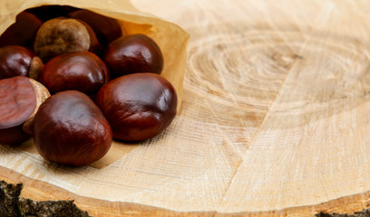 fresh clean shiny chestnuts in paper wrapping.