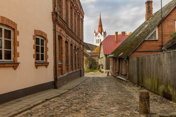 Fototapeta premium Street with residential houses in the old town of Cesis