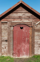 Red toilet with heart.