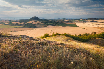 Beautiful summer sunset on the view point above the deep valley in Ceske stredohori mountains, Czechia