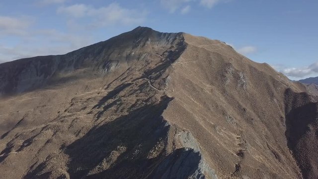 Range of peaky mountains in sunshine