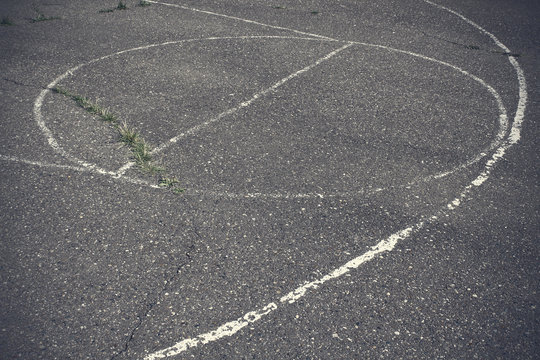 Old asphalt basketball court. Close-up. Top view. Background. Texture.