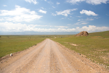 Obraz premium Road to Song kol lake - landscape of high plateau in Kyrgyzstan