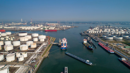 Port of Rotterdam. Botlek. Oil refinery plant from industry zone, Aerial view oil and gas industrial, Refinery factory oil storage tank and pipeline steel