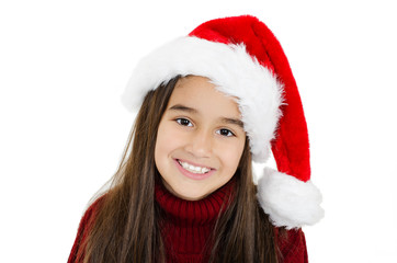  Beautiful little girl in red Santa hat. Isolated on white background 