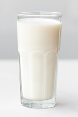 Glass of milk  on a white marble table