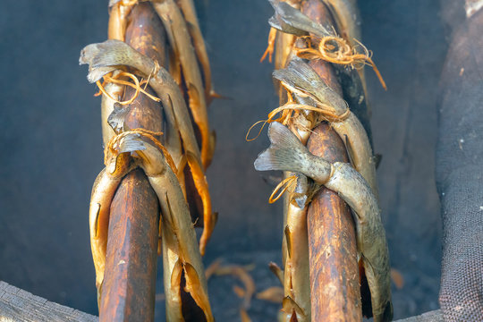 Traditional Scottish Smoked Fish Cooking In Wooden Barrel. Ancient Way Of Smoked Meat. 