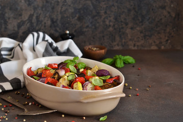 Oven Roasted Vegetables: zucchini, eggplant, tomatoes, paprika. Ratatouille is a rustic dish of vegetables.