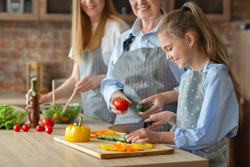 Obraz na płótnie Canvas Cropped photo of three women making healthy food