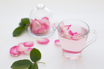 Rose  petals tea in a white background. Horizontal
