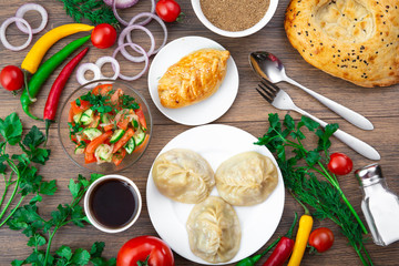 Assorted Uzbek food set, pilaf, samsa, lagman, manta, shurpa Uzbek restaurant concept, Uzbek