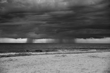 Rain and Clouds in a black and white photo of North Clearwater beach just before the storm