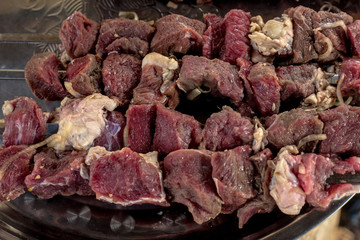 raw beef meat on skewers, barbecue