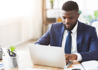 Young businessman working in modern high tech office