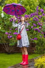 woman with umbrella in the garden