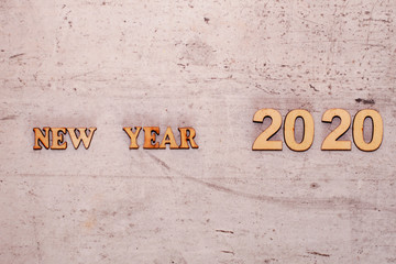 The idea of the new year. Free space for an inscription. The inscription happy new year 2020 on a traffic light closeup background. Christmas paraphernalia.