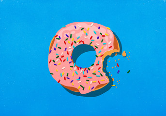 Missing bite from donut with sprinkles