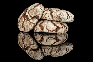 Group of three whole baked chocolate brownie cookie isolated on black glass