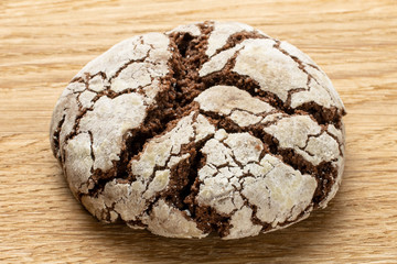 Group of two whole baked chocolate brownie cookie on natural wood