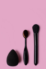 Cosmetics and accessories on a pink background. flat lay.