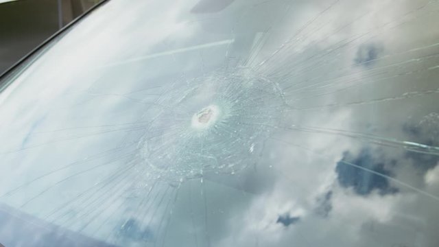 Detail Of Damage To Windscreen Of Car Shattered By Vandalism