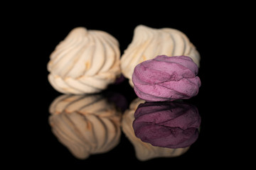 Group of three whole airy fresh pastel zefir isolated on black glass