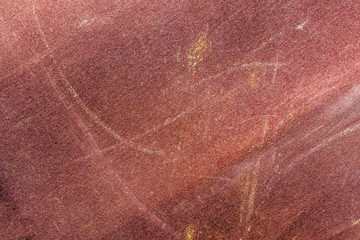 Fototapeta na wymiar worn texture of sandpaper, close-up abstract background