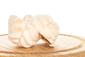 Group of two halves of apricot fresh pastel zefir one sliced on bamboo plate isolated on white background
