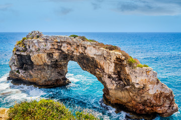 Fototapeta na wymiar Beautiful natural rock arch at viewpoint, Mirador Es Pontas, island of Mallorca, Balearic islands, Spain