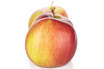 Group of four whole red apple jonagold isolated on white background