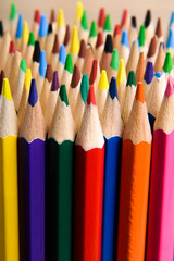 Fototapeta premium Different colored pencils on the brown wooden table background .Top view .Close up .Color .Pencil.Set