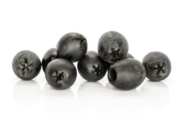 Lot of whole tasty black olive isolated on white background