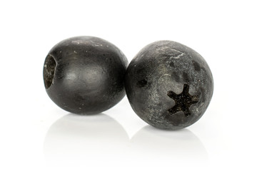 Group of two whole tasty black olive isolated on white background