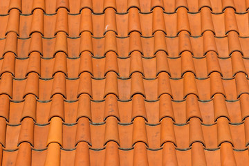 A roof tiled with imbrices and tegulae. Photo in perspective