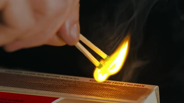 Lighting Two Matches on Matchbox Slow Motion