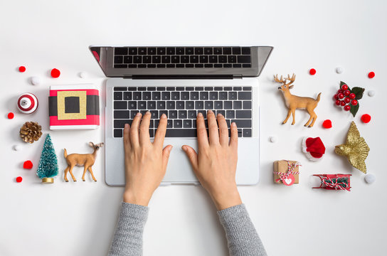Christmas theme with laptop computer and xmas ornaments from above
