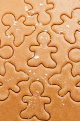 Christmas gingerbread men cookie background. Christmas dough cookie pattern